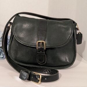 Coach Green Vintage Chelsea leather crossbody saddle bag in black. 